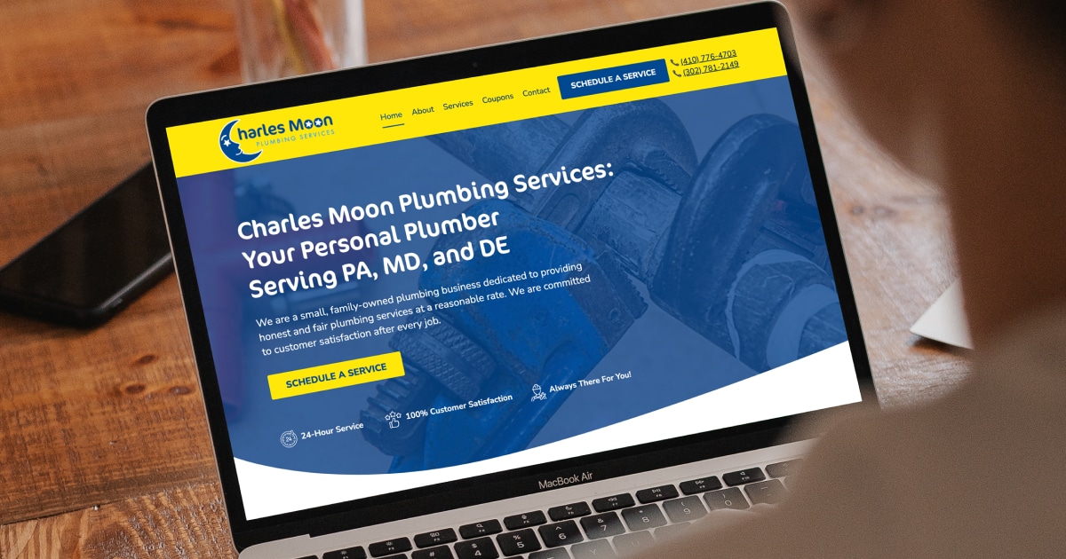 laptop showing the Charles Moon Plumbing website